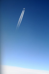 Airplane in the blue sky