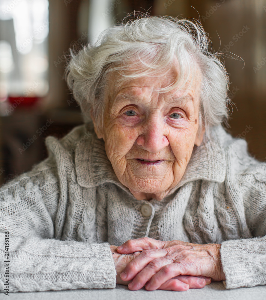 Wall mural Portrait of a very old woman, retired.