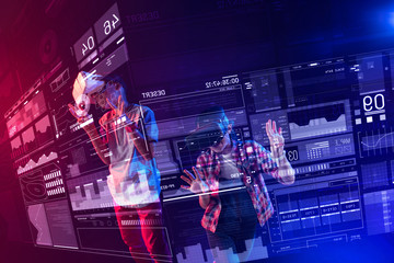 Amazing opportunities. Positive modern kids feeling happy and wearing virtual reality devices while using futuristic computers with transparent screens