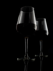 glasses of red wine in a dark atmosphere