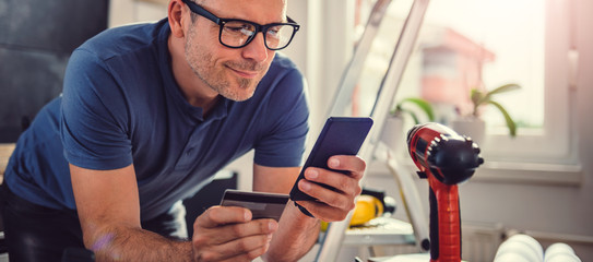 Men shopping online during kitchen renovation