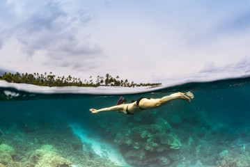 Snorkeler over reef in Hawaii