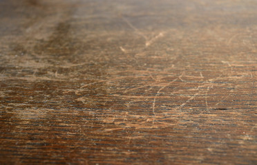 Close up of vintage style, old, used, dark, textured wood with scratches