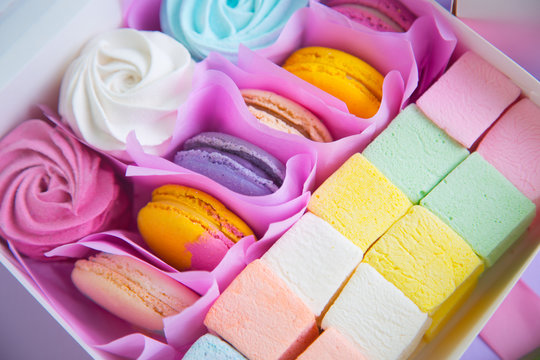 Multicolored set of different sweet marshmallow and macaroons in box
