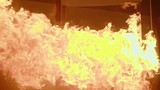 Slow motion of a burning fire with large flames