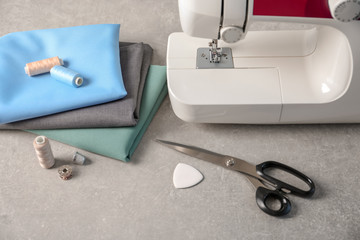 Sewing machine, fabrics and accessories for tailoring on table