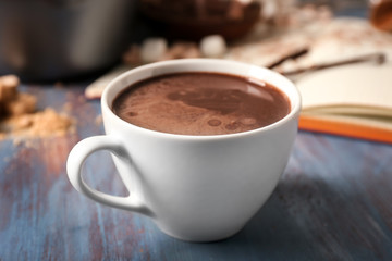 Cup of hot chocolate on wooden table