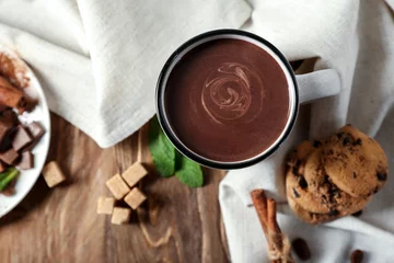 Fototapeten Cup of hot chocolate on wooden table © Pixel-Shot