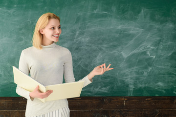 Education. Job. People concept. Educational theme. Portrait of smiling teacher in classroom....
