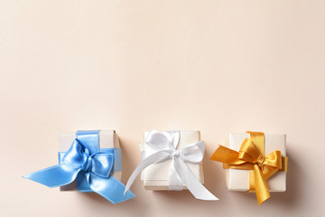 Beautiful gift boxes on light background, top view