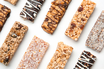 Different grain cereal bars on white background. Healthy snack