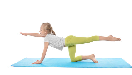 Little girl practicing yoga on white background