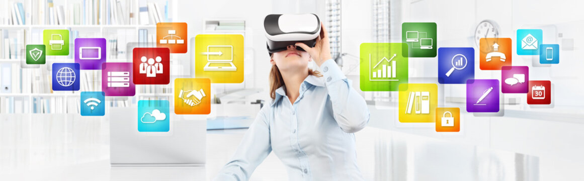 Woman wearing virtual reality glasses in office, with colors icons, web banner copy space