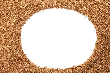 Gordijnen Raw buckwheat on white background. Healthy grains and cereals © New Africa