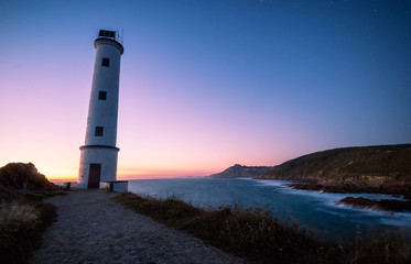 Obraz premium lighthouse at sunset