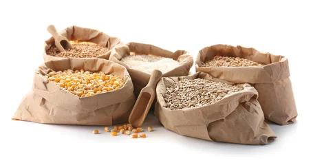 Schilderijen op glas Paper bags with different types of grains and cereals on white background © New Africa