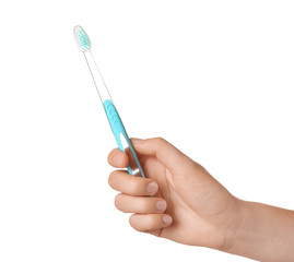 Woman holding manual toothbrush against white background
