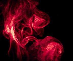 Red smoke on black background