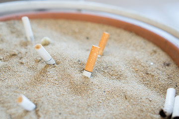 Smoked Cigarettes in the sand ashtray