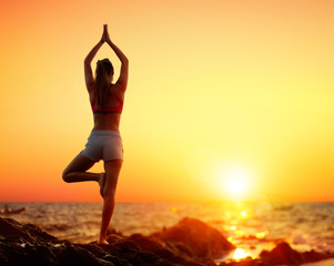 Yoga At Sunset - Girl In Vrikshasana Pose