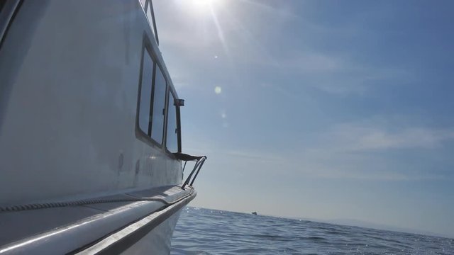 View from aside of moving boat in sea