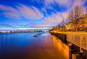 Quayside boardwalk in the evening. Fraser river, New Westminster, BC, Canada.