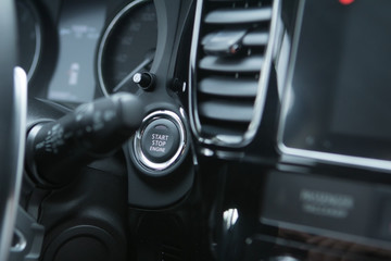 Obraz na płótnie Canvas Car engine start stop button of a modern car.