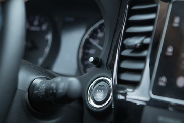 Fototapeta na wymiar Car engine start stop button of a modern car.
