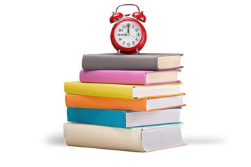 Alarm Clock on Stack of Books