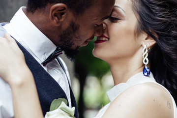 Wedding day. Stylish african groom and his pretty bride.
