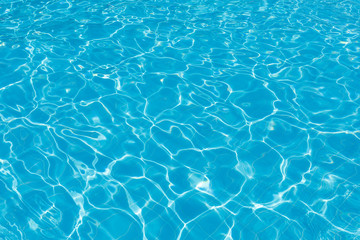 Clean turquoise water in the swimming pool as a background or backdrop