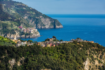 Fototapeta na wymiar View of Corniglia and Manarola, colorful villages of Cinque Terre, Italy.