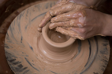 Ceramic artist working on a pottery wheel