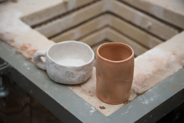 Fototapeta na wymiar Raw pottery piece on a kiln