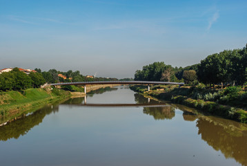 Fototapeta na wymiar Reflection of a bridge on the Arno River