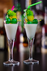 exotic drink based on Malibu rum and other ingredients, cocktail prepared by the bartender