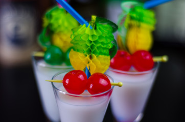 exotic drink based on Malibu rum and other ingredients, cocktail prepared by the bartender