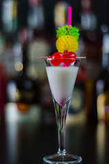 exotic drink based on Malibu rum and other ingredients, cocktail prepared by the bartender