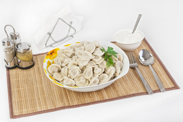 Russian dumplings with herbs and onions.