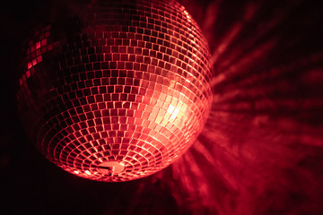 lone disco ball illuminated red - 214158368