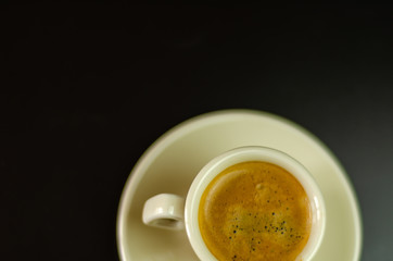 black coffee in a ceramic cup on the bar, energy drink in a public place