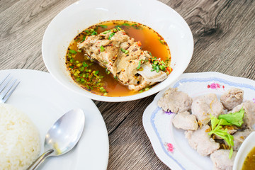 Sour pork spare rib soup, Spicy spare pork backbone, Hot and spicy pork backbone hot pot or Leng hot pot. Steamed pork with dipping sauce and cooked rice. Thai food.