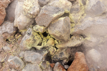Closeup from steaming sulphur fumaroles at geothermal area Hverir in north Iceland