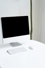 desktop computer on white table