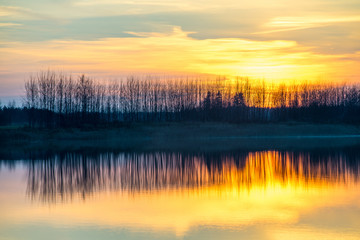 Sunset on the lake. Reflections in water. 