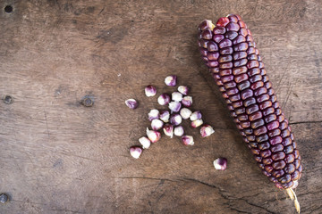Close up corn, corn color on the wood background