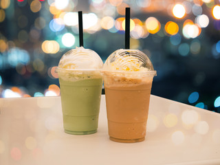 Coffe frappe and green tea frappe on bokeh background. - 214169528