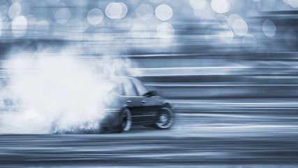 Car drifting, Blurred of image diffusion race drift car with lots of smoke from burning tires on...