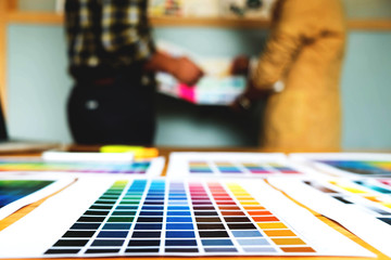 Fototapeta premium Graphic designers choose colors from the color bands samples for design .Designer graphic creativity work concept .