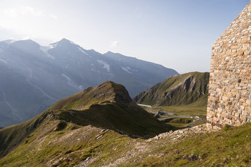 Naklejka premium Alpine scenery on the top of the Grossglockner mountain pass, with the road in the background, in the Austrian alps in Europe in summer